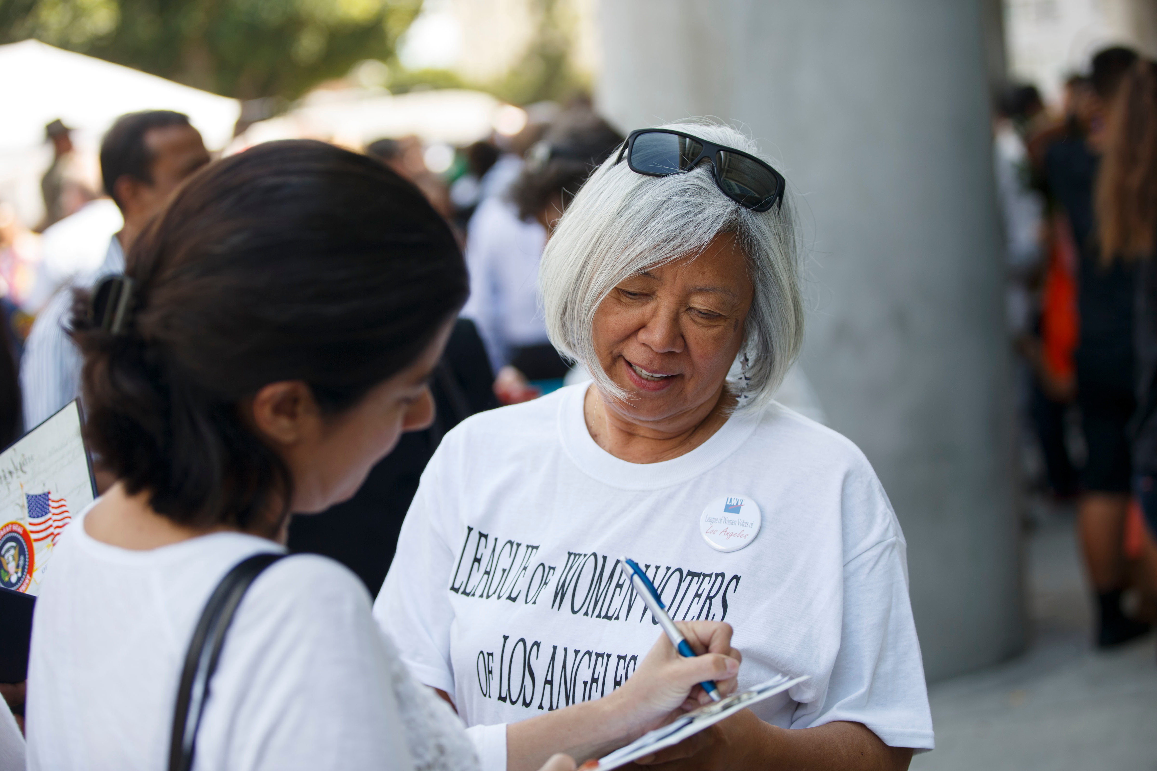 League member register a voter League of women voters registering voter