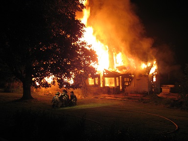 house burning at night 