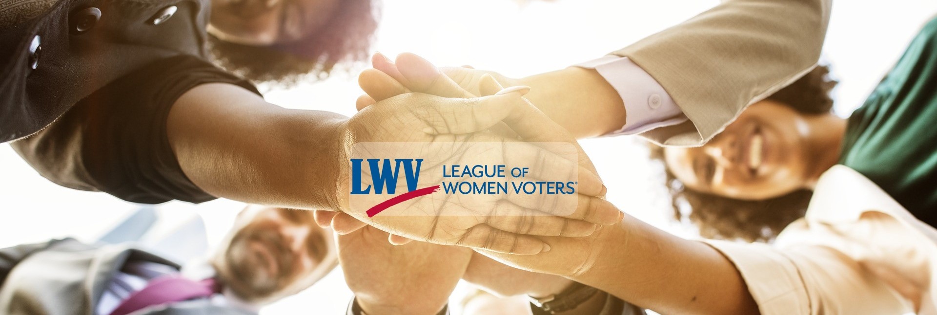 League of Women Voters | image of 4 people extending arms, hands stacked