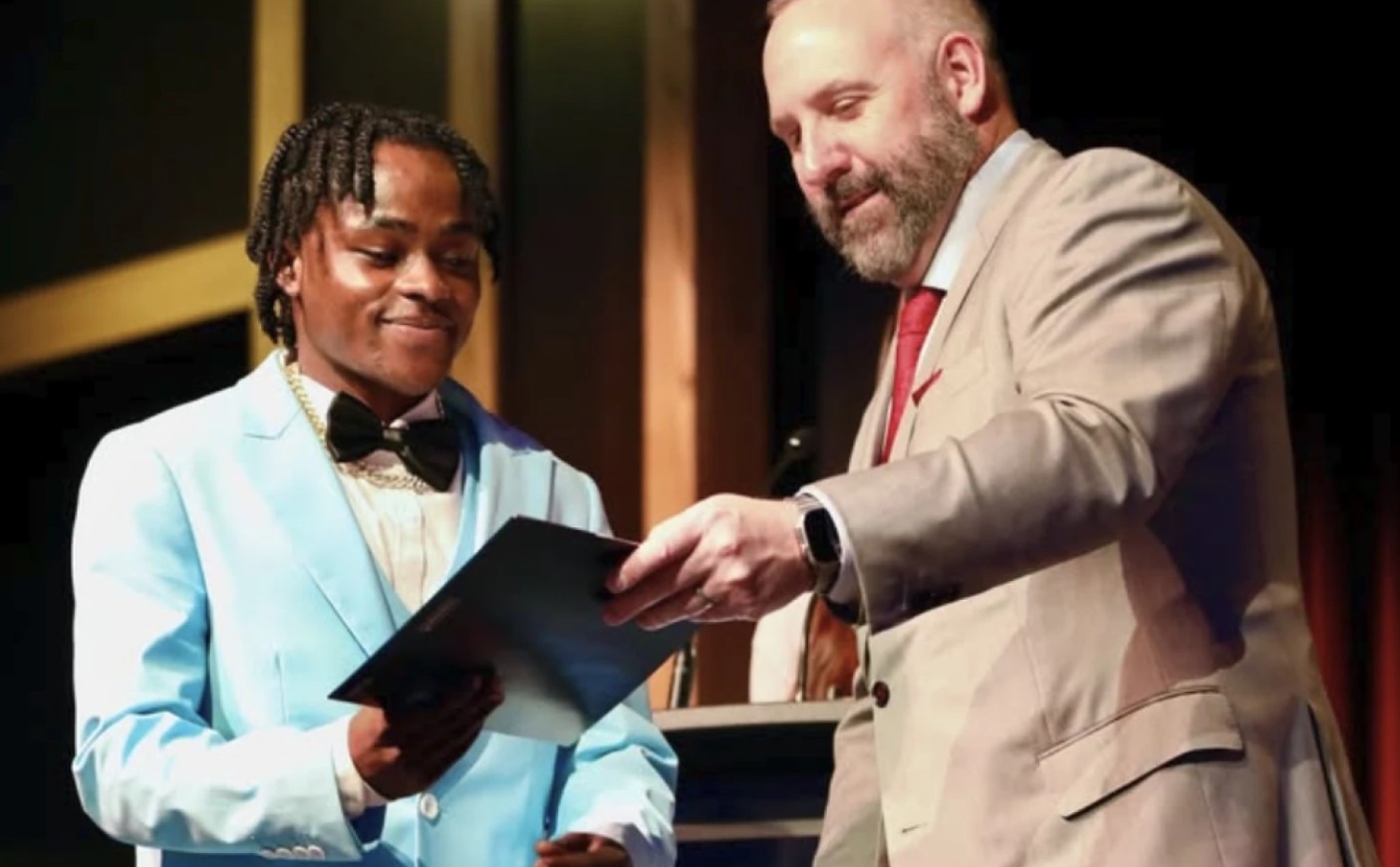 Pierre Damas Bel is pictured receiving a scholarship in a photo posted on May 1 on the Springfield City School District's Instagram.