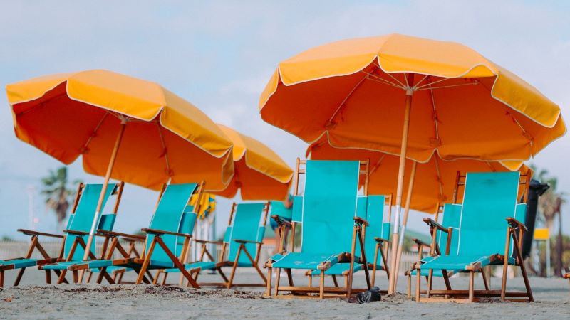 Photo of Lounge Chairs and Orange Beach Umbrellas