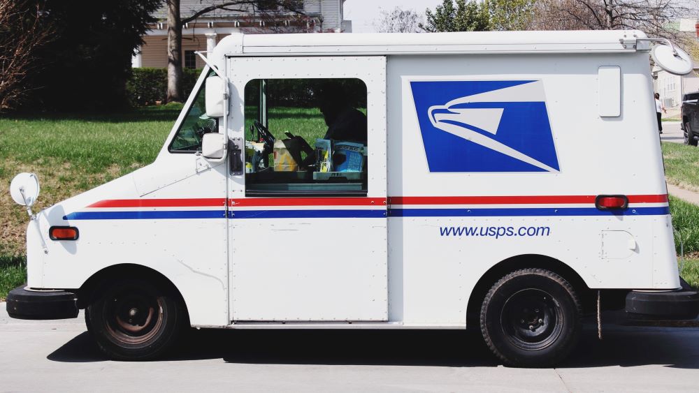Photo by Pope Moysuh on Unsplash USPS Mail Truck