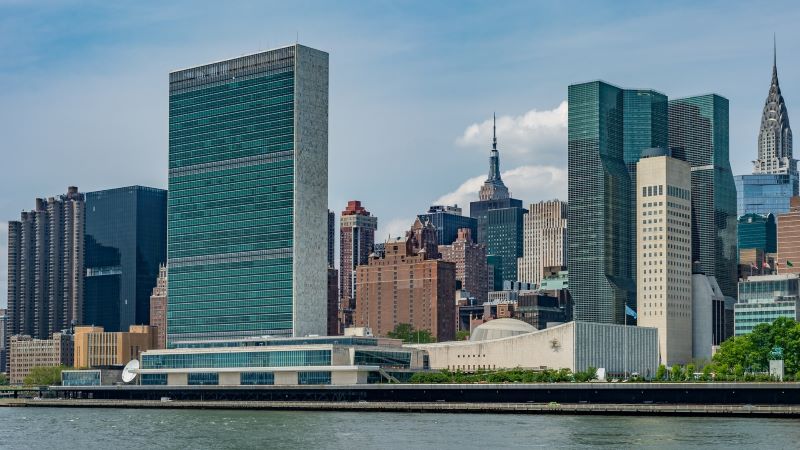 Photo of the United Nations with East River in foreground