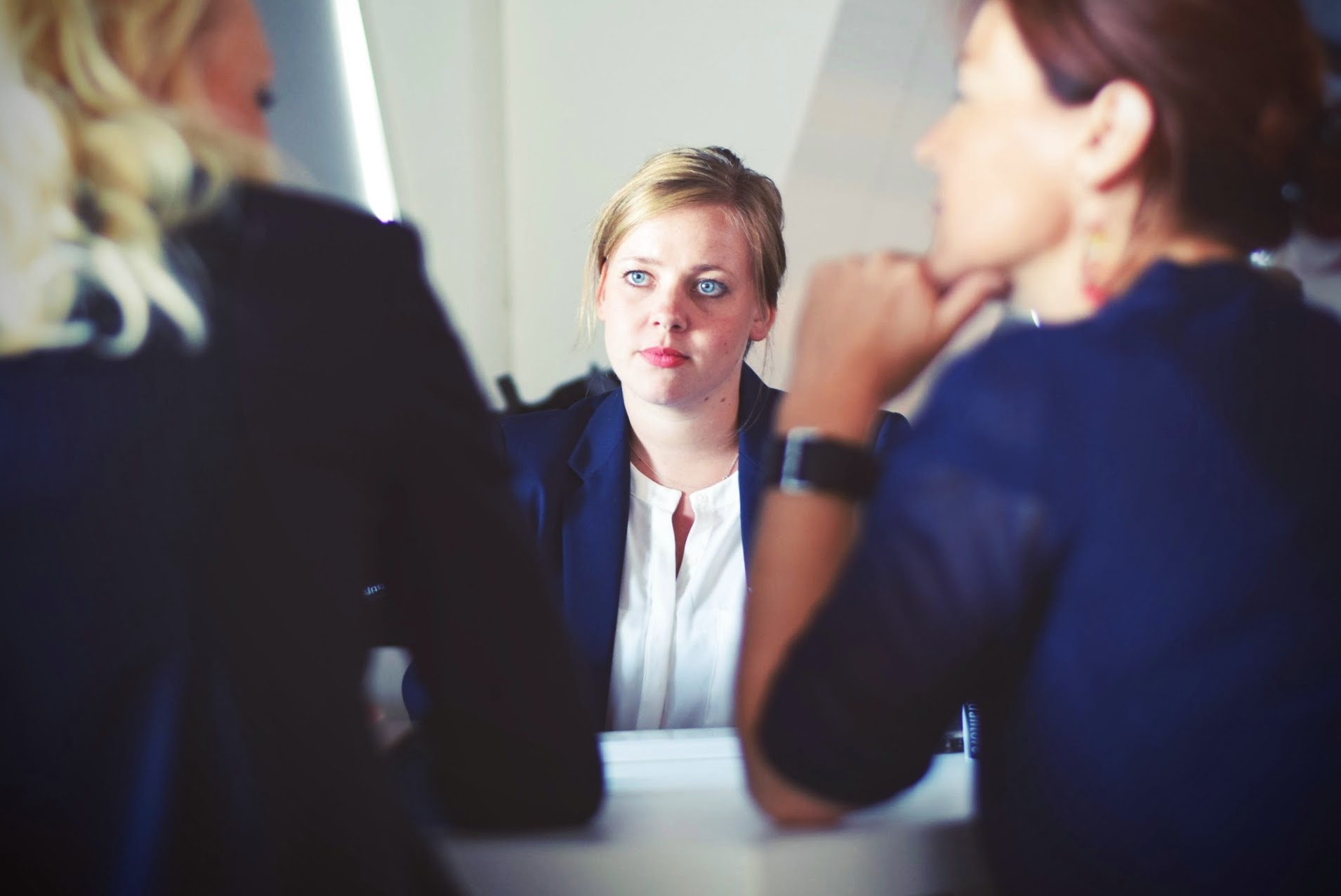 Photo by Tim Gouw on Unsplash Women in discussion around a table