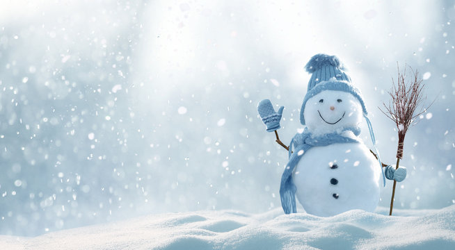 A bright snowy day with a cute snowman waving at you.