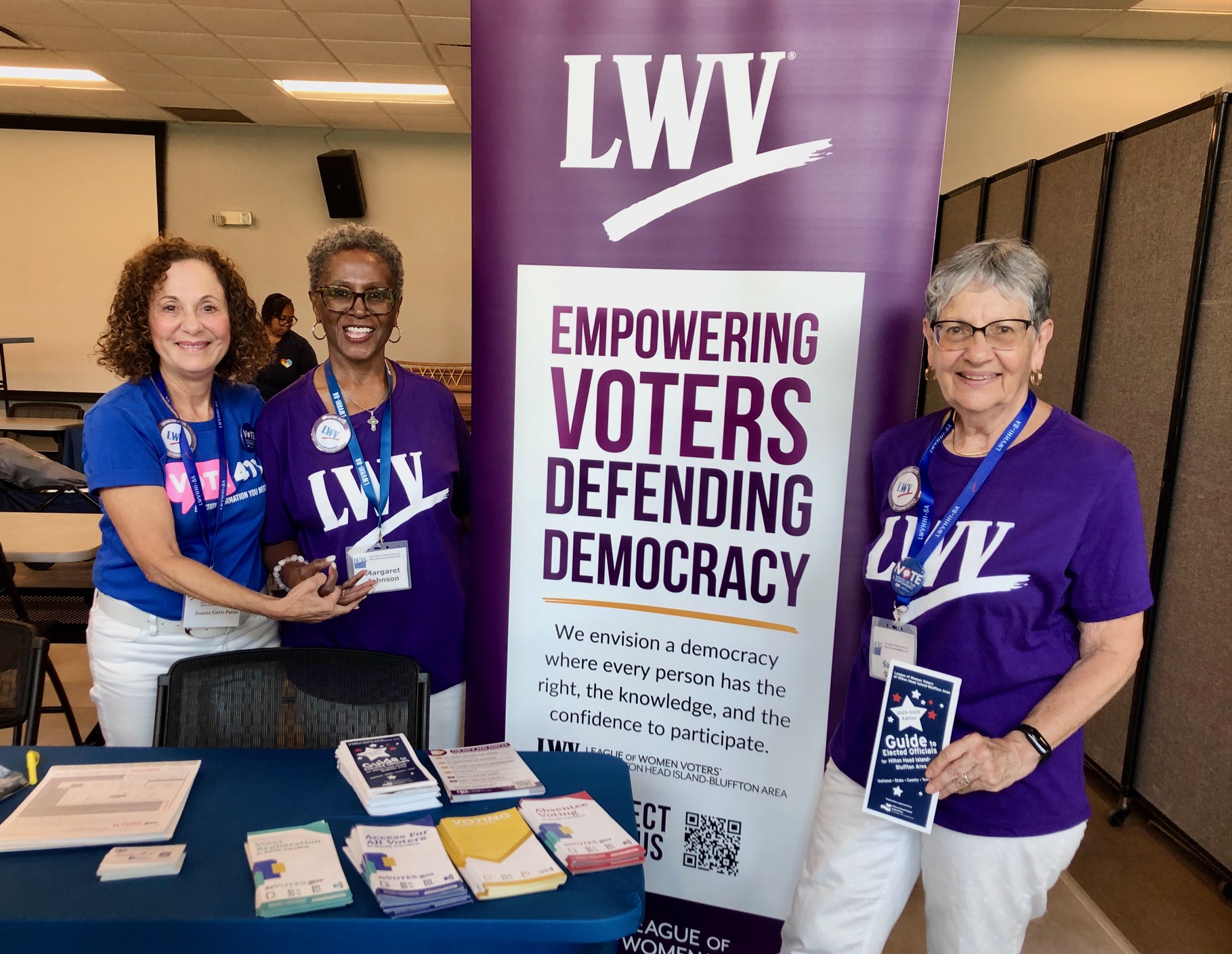 HHI trio with mission banner