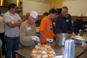 Clients choose food at free meal