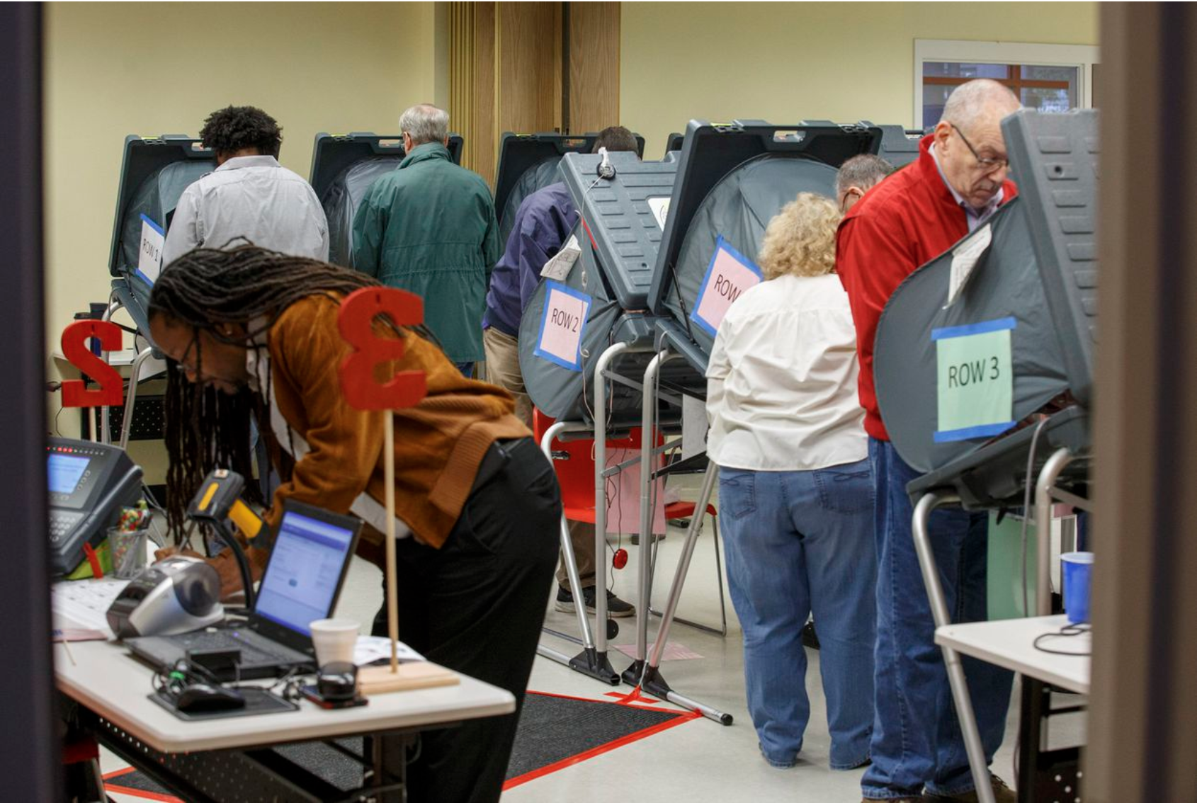 Texas voters exercising their right to vote in recent election. Photo by Michael Stravato for The Texas Tribune photo of Texas voters in the process of voting.