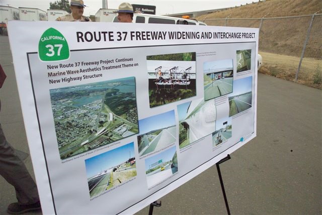 Board displaying plans for highway changes