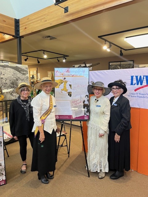 League members present a briefing on the history of womens voting rights