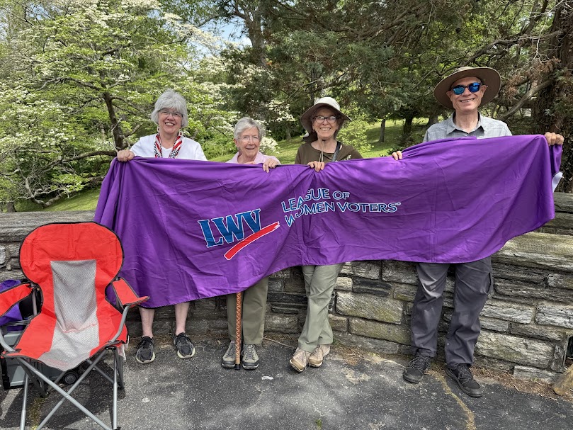 LWVCDC members display banner at Stand Tall for Workers rally