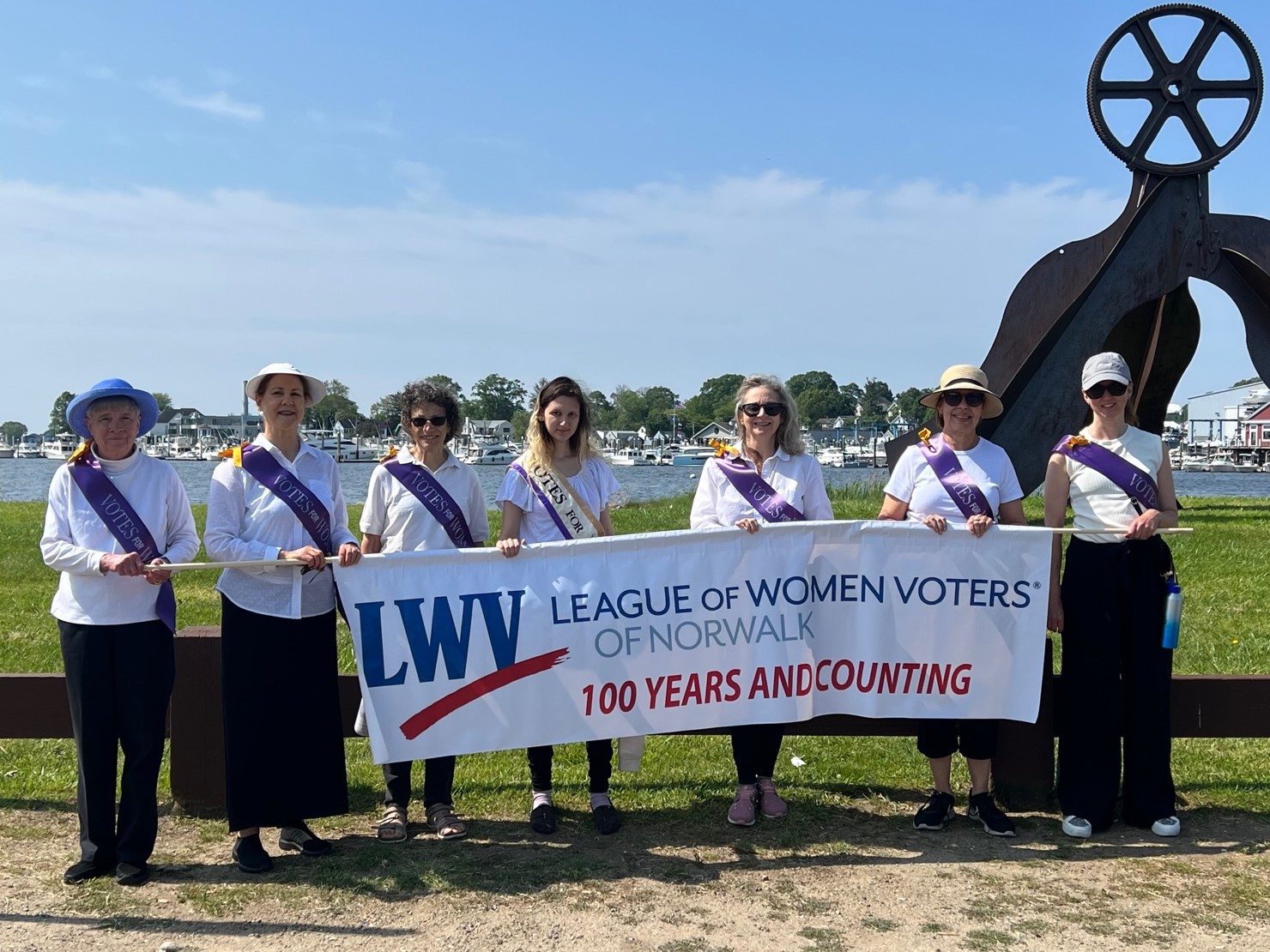 League members with "100 Years and Counting" banner, Memorial Day Parade 2023