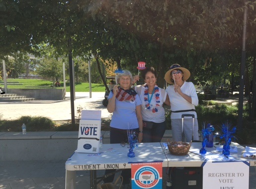 League members doing voter registration at local community college