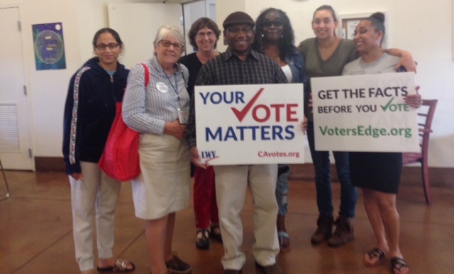 group of men and women with Vote sign