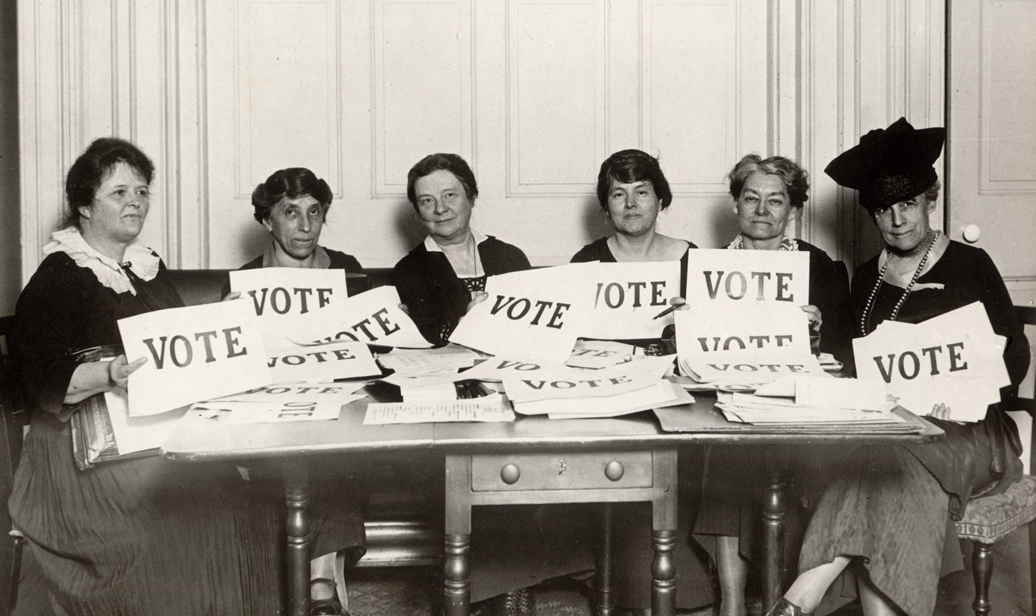 Early League members pose with 'Vote' signs