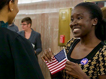 Woman meeting legislator Woman w flag meeting legislator