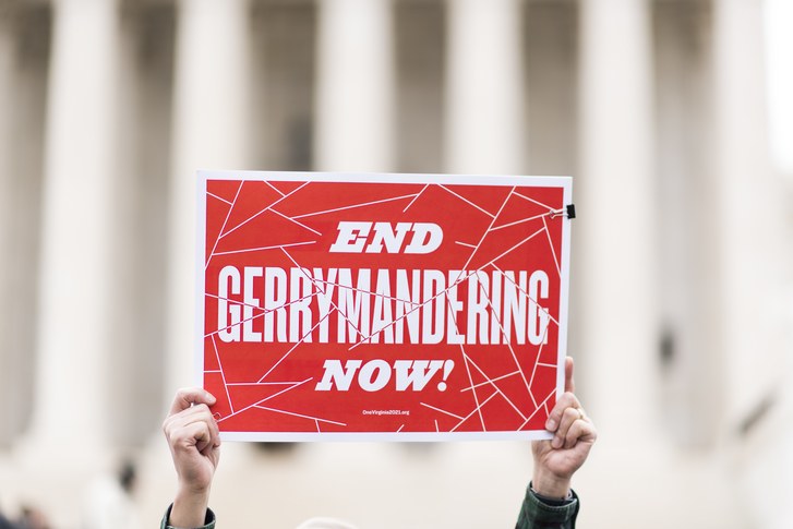 Image of person holding a sign