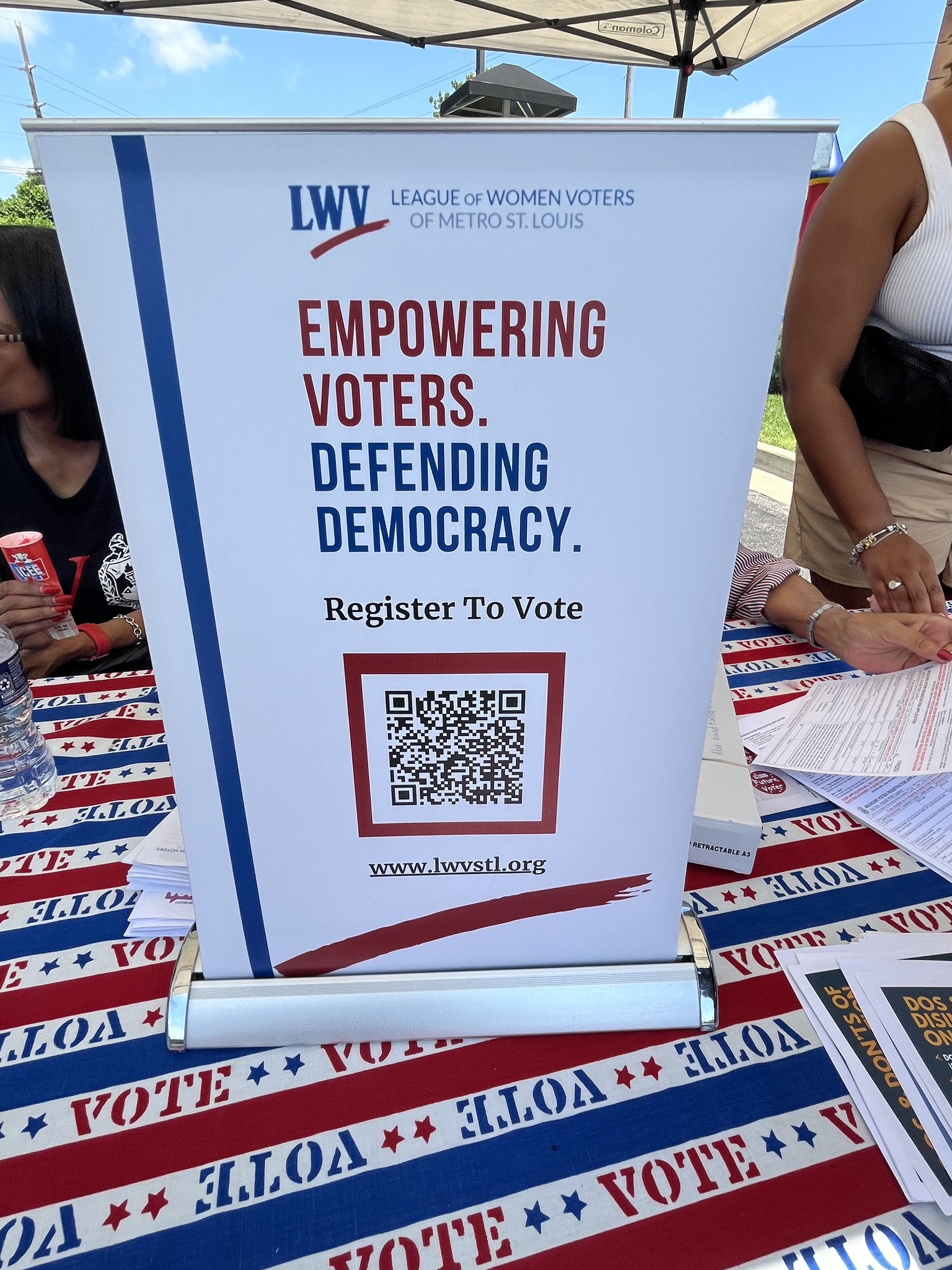 Sign with QR code at voter registration event