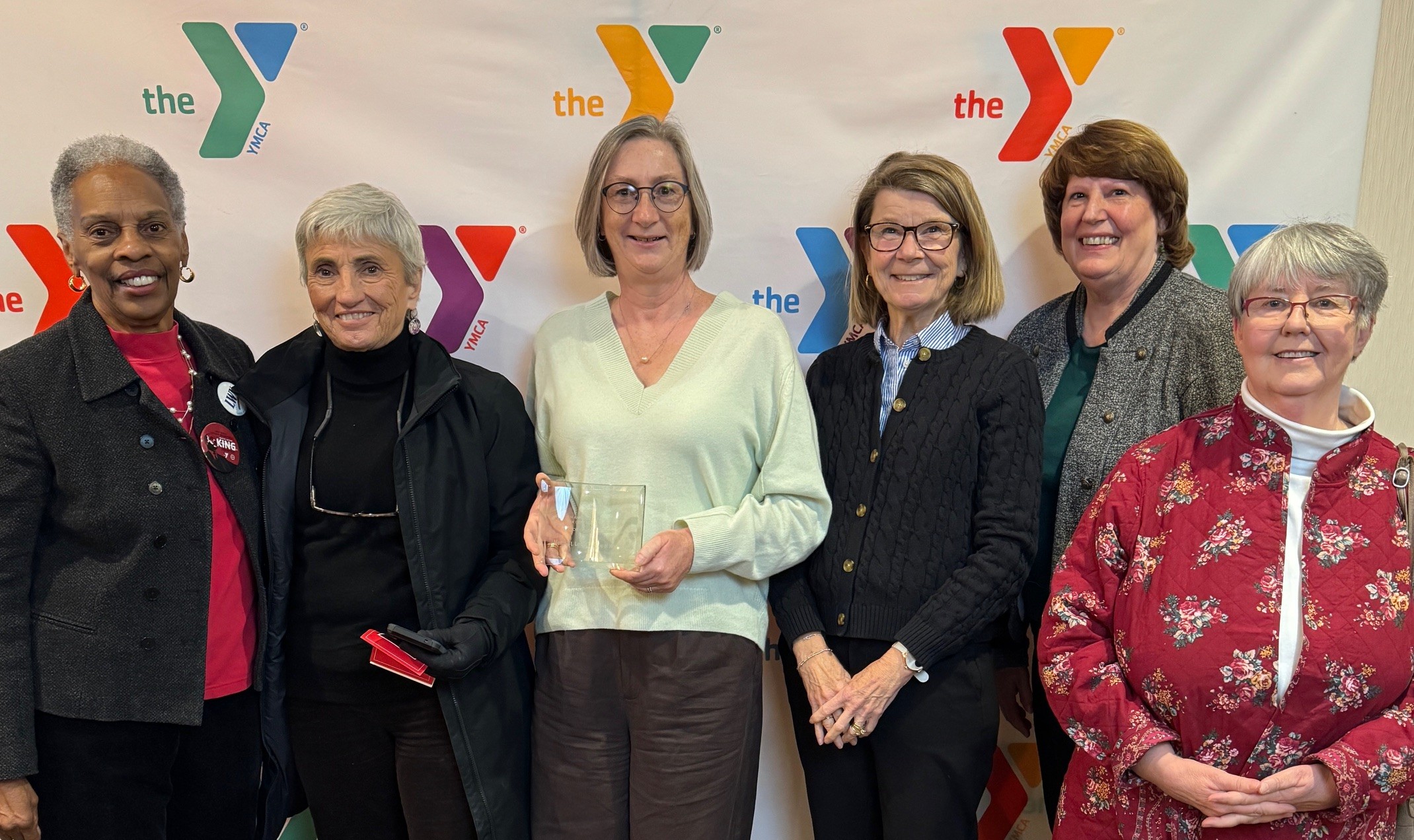 Joan Hubbard, Mary Toy, Victoria Turner, Julie Gaebe, Jean Dugan and Kathleen Farrell accept award at the 40th Annual Bayer YMCA Martin Luther King Jr. Breakfast.