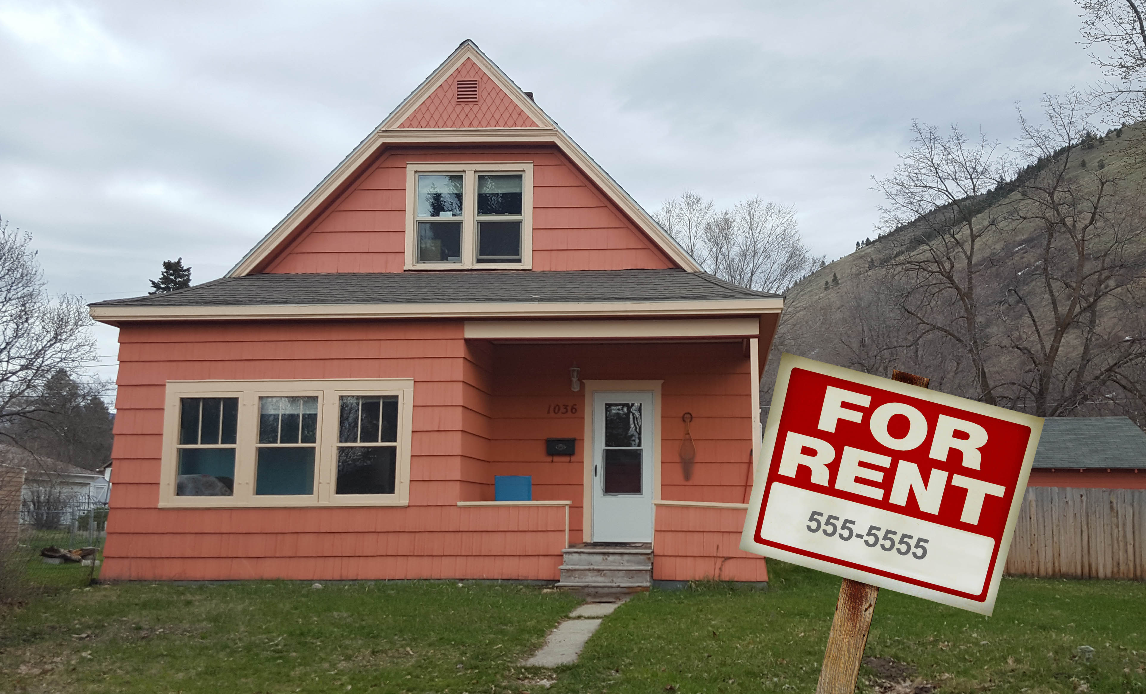 photo of house with for rent sign in the front
