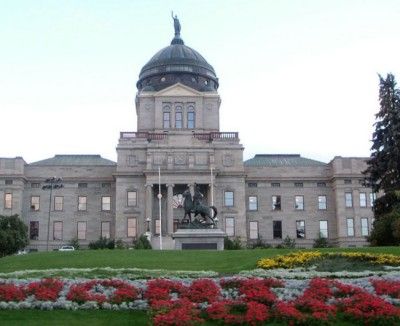 Montana state Capitol building with flower beds in foreground