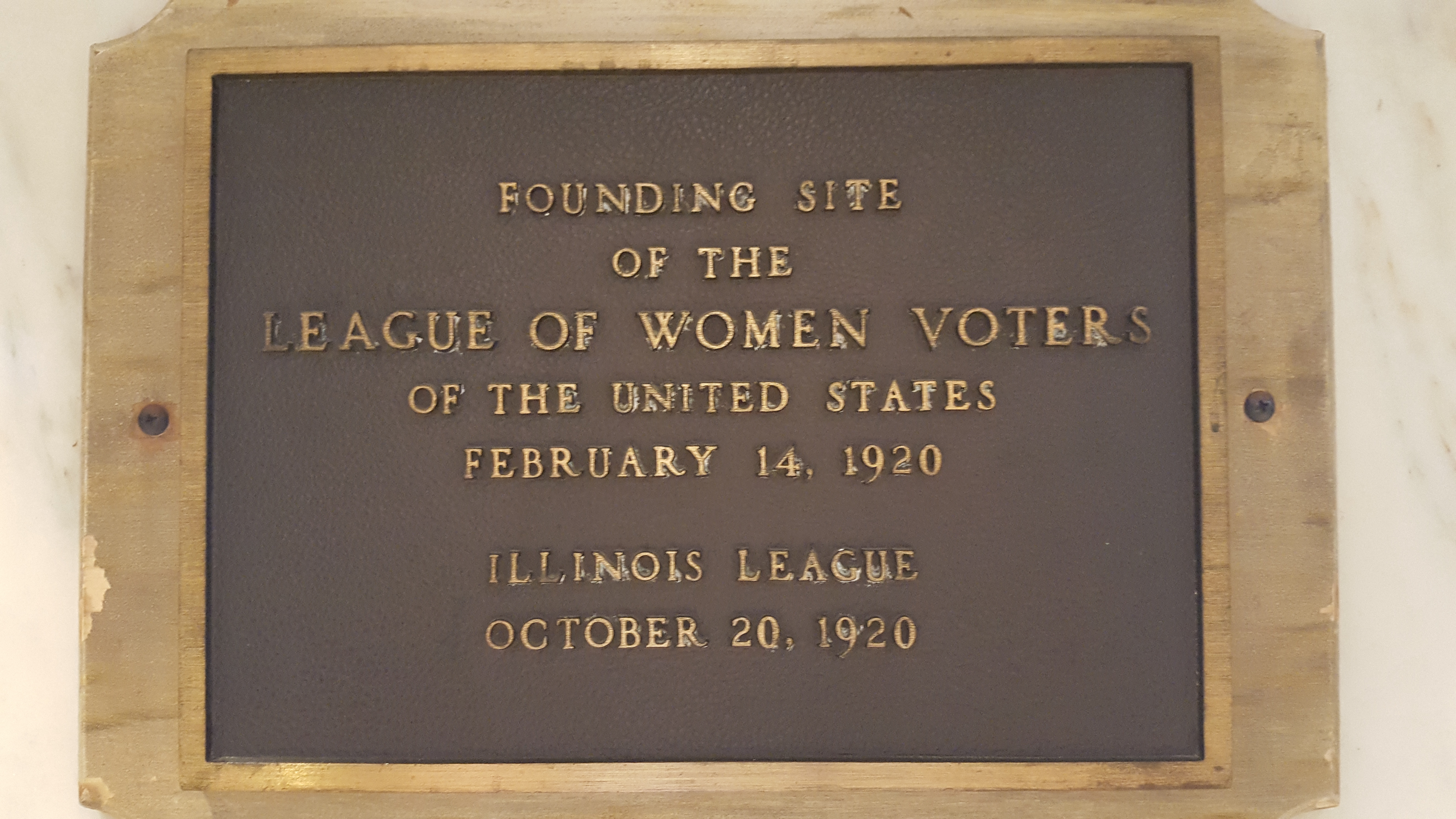 photo of plaque on the wall of location in Chicago where League was founded