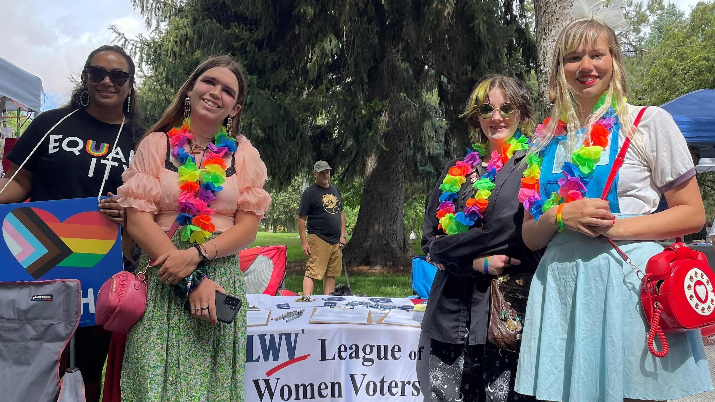 A group of people at a voter registration table