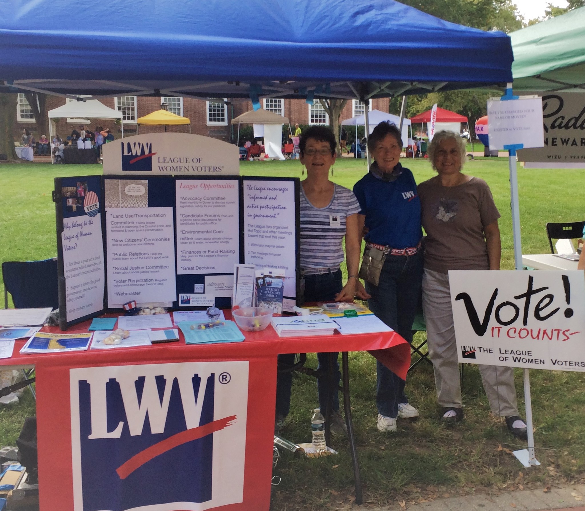 Voter Registration Booth with LWV and "Vote!" signs