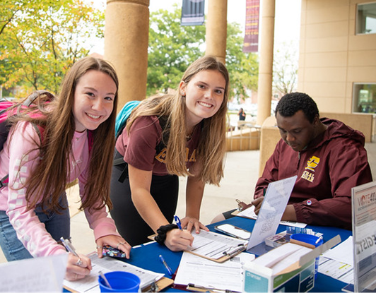 2 students registering to vote