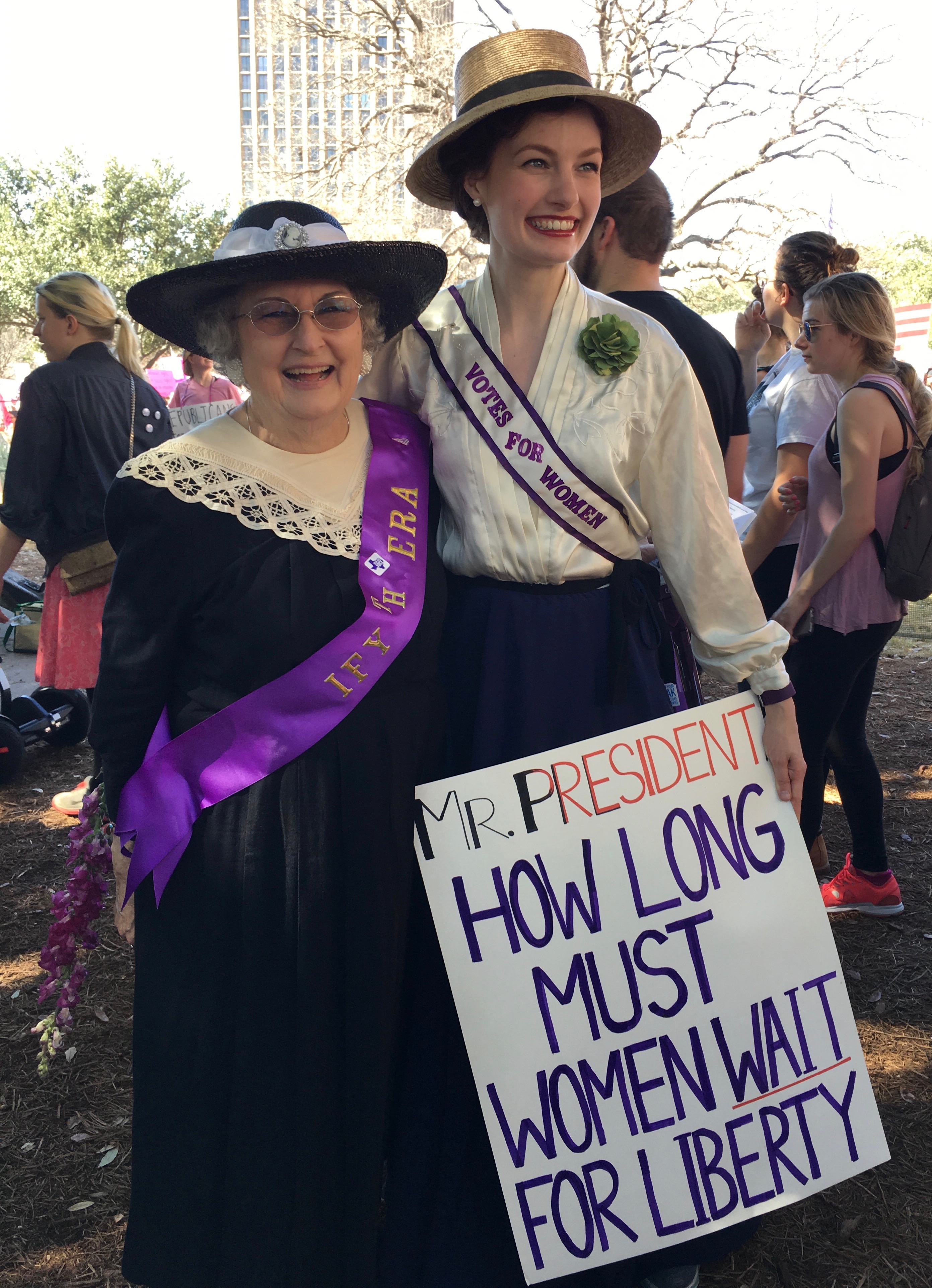 Suffragists dressed in vintage clothes at the Women's March 