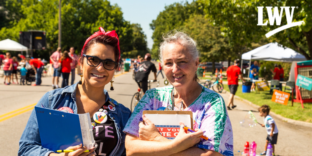 Two women registering voters