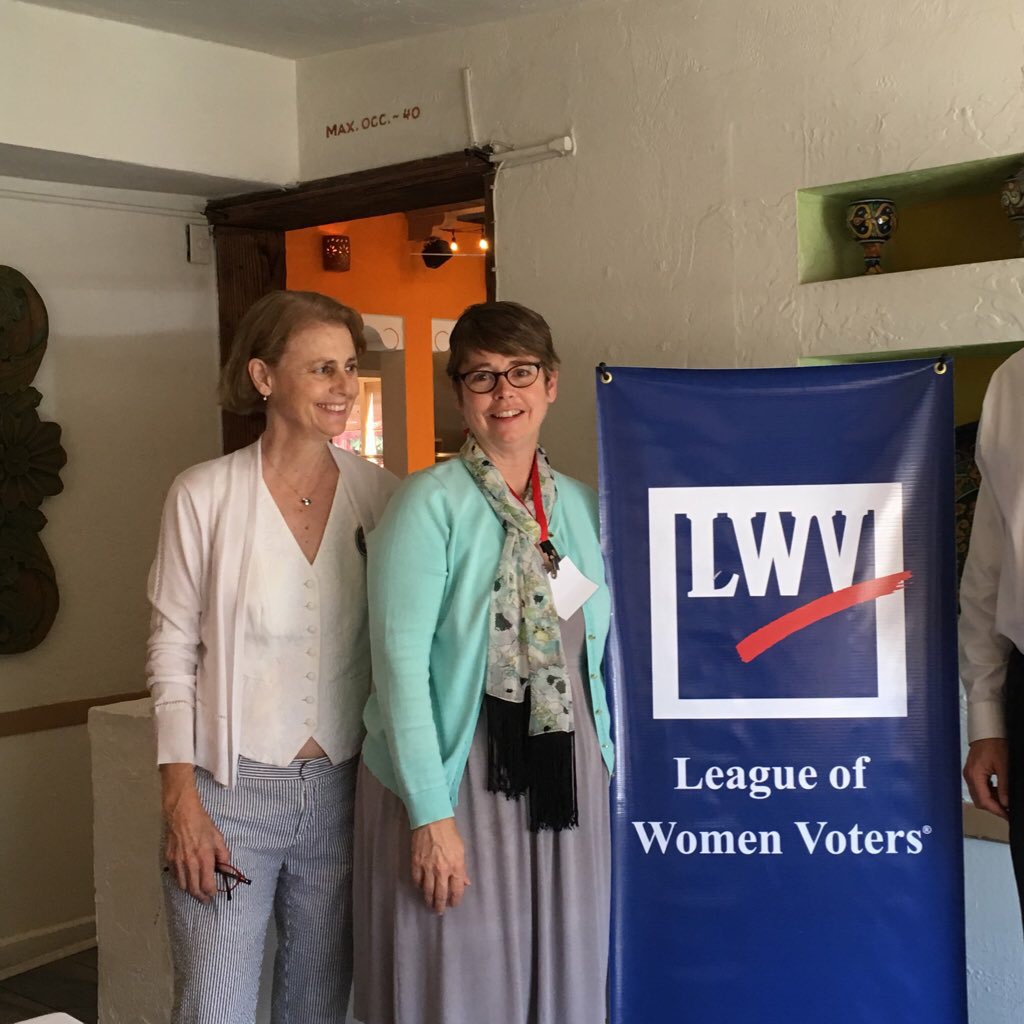 Members at annual meeting with LWV signage