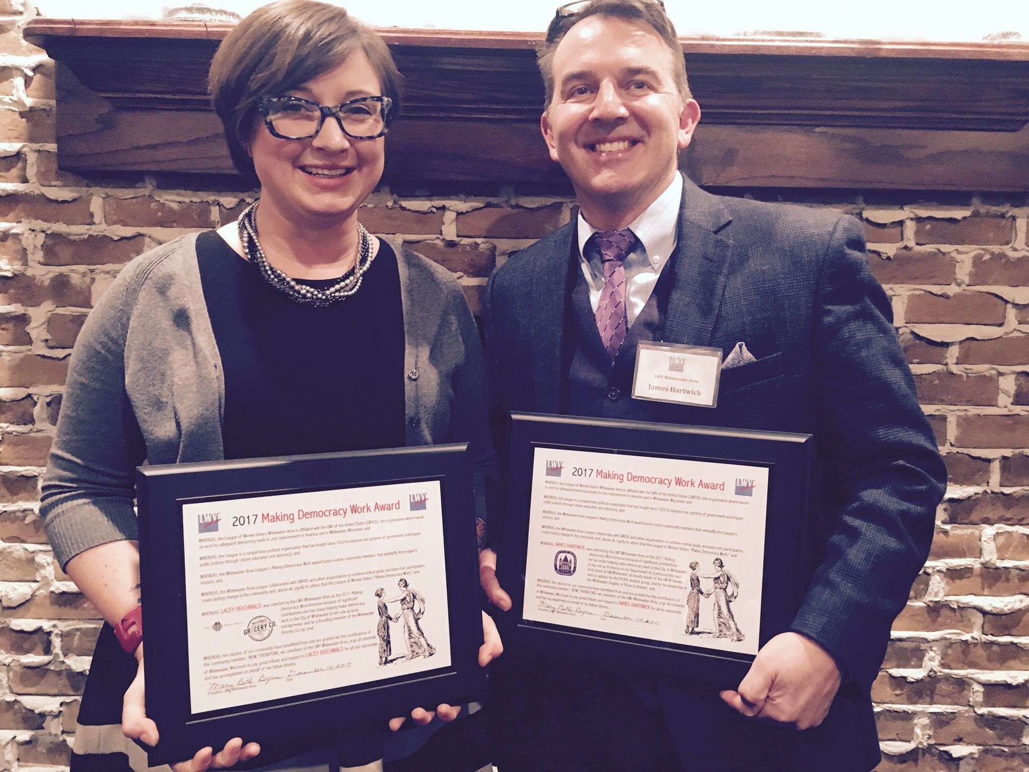 Lacey Reichwald and James Hartwick accept the 2017 Making Democracy Work Award