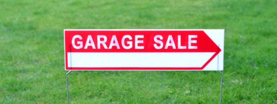 Green grass with red "garage sale" sign