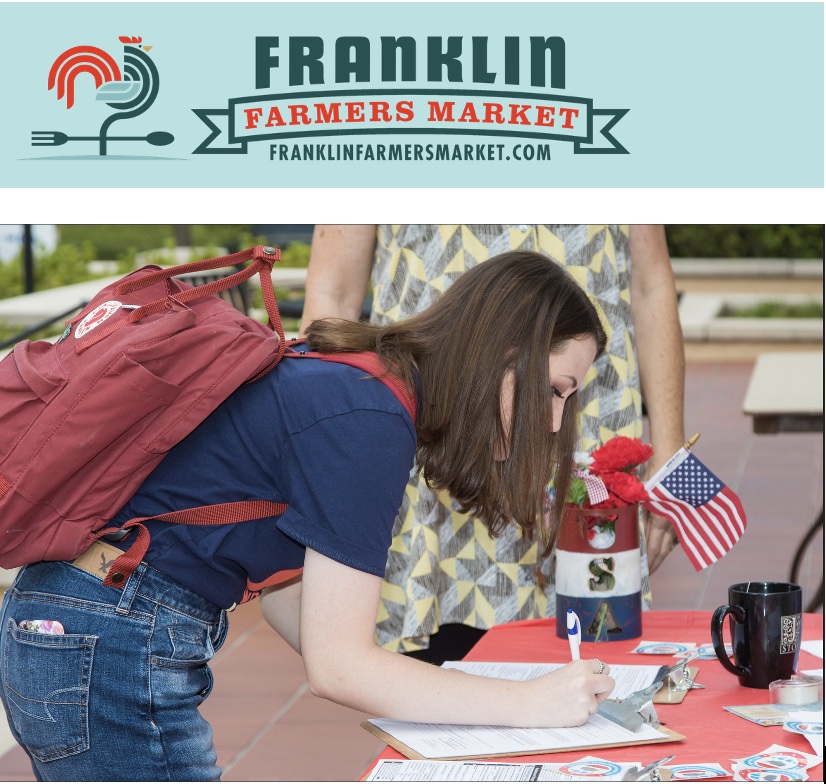 Photo of woman registering to vote 