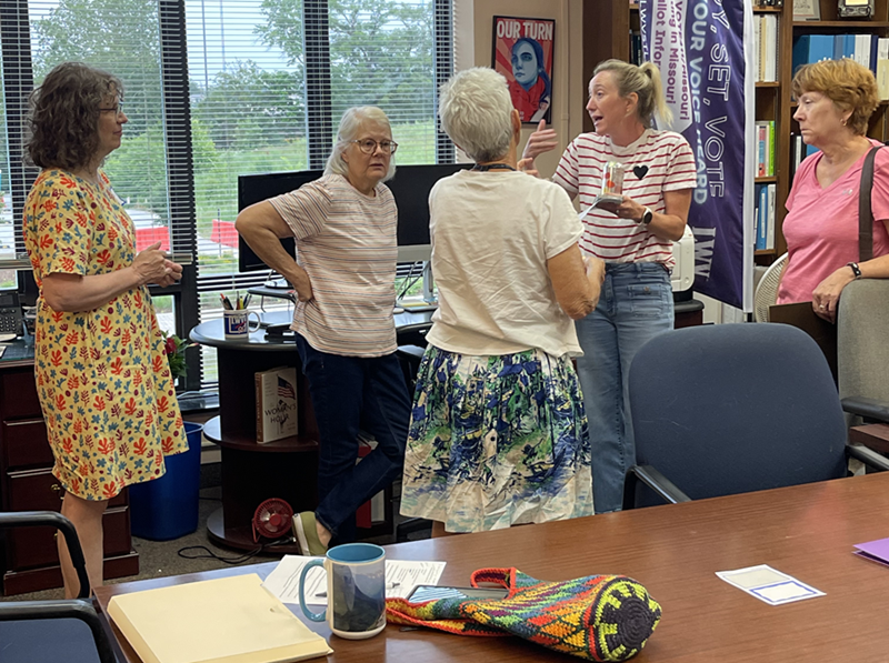 Get Out the Vote Committee Members in Animated Conversation