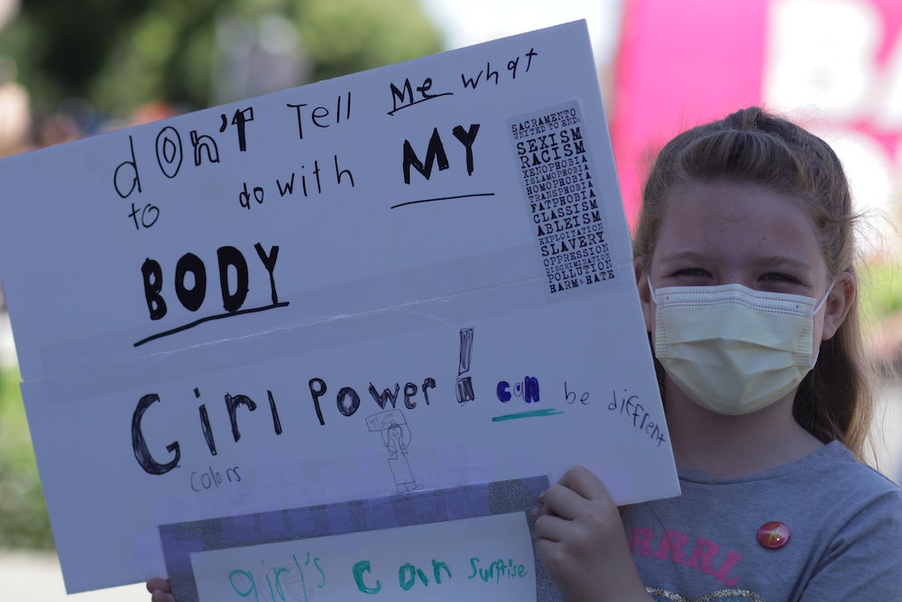 Girl holding Girl Power Sign