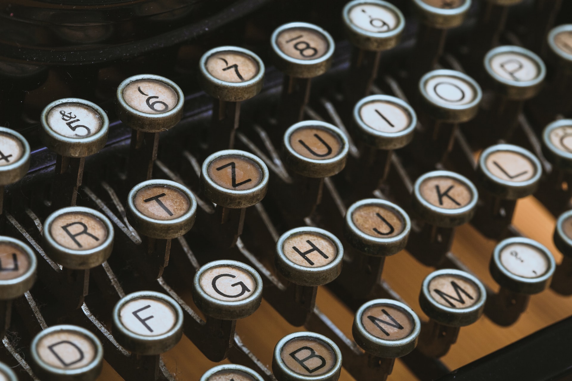 Photo by camilo jimenez on Unsplash Photo of old typewriter keyboard
