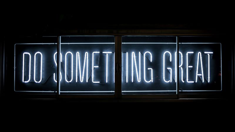 Photo by Clark Tibbs on Unsplash "Do Something Great" Neon Sign