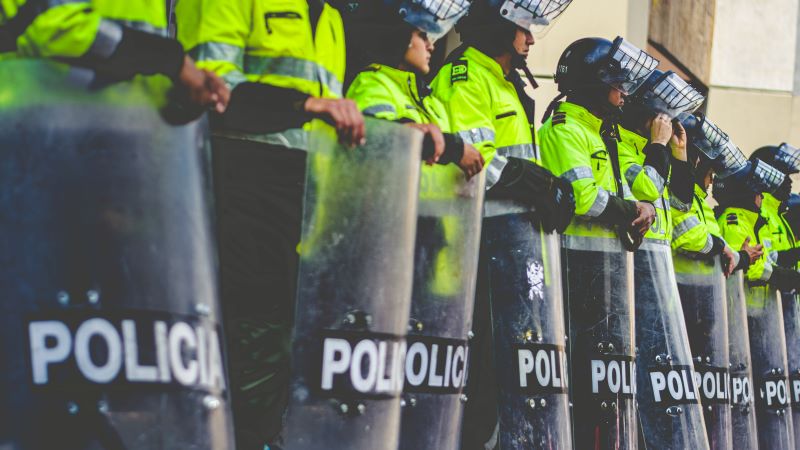 Photo by Ricardo Arce on Unsplash Photo of police in riot gear