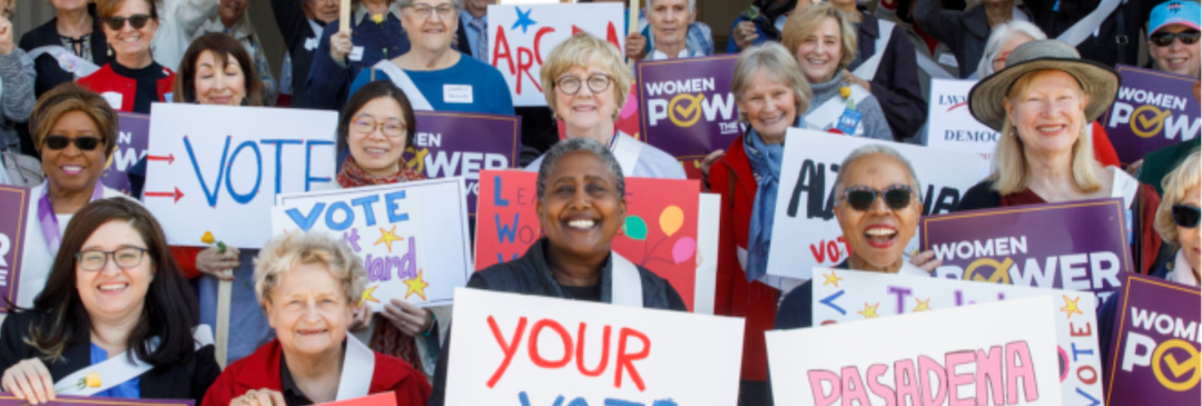 A group of people holding signs that support voting rights