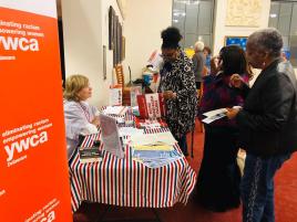 Patti Christopher manning an LWVNCC voter information table