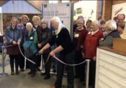 Cutting ribbon at Anoka History Center Opening