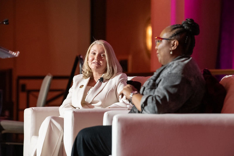 President Dianna Wynn and CEO Celina Stewart sitting in chairs onstage