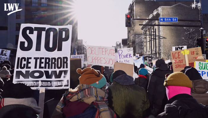 A protest with a sign that says "Stop ICE terror now!"