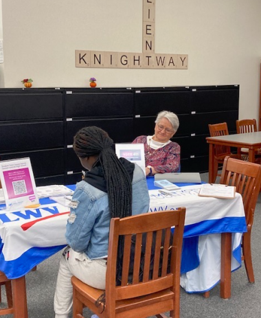 LWVSC member Lynette Brown registers new voter at Sussex Central