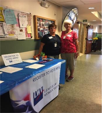 Ex-Felon Voter Registration Two women standing by voter registration table