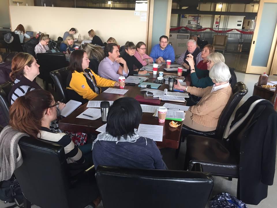 League members study all sides of issues League study group discussion around a table