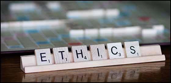 A Scrabble tray holding tiles that spell the word ETHICS A Scrabble tray holding tiles that spell the word ETHICS