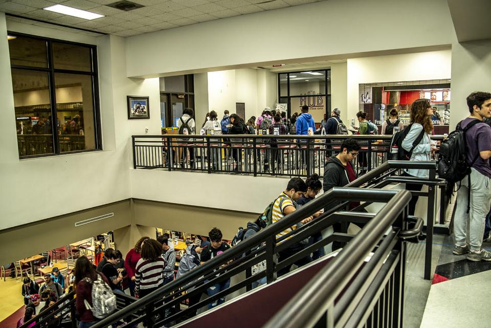 Texas State Students in line to vote on stairs